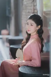 Serene Beauty of a Lady in Pink Traditional Dress with Spring Blossoms - image 7