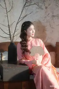 Serene Beauty of a Lady in Pink Traditional Dress with Spring Blossoms - image 0