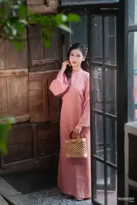Serene Beauty of a Lady in Pink Traditional Dress with Spring Blossoms - image 5