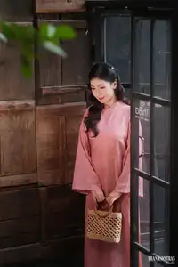 Serene Beauty of a Lady in Pink Traditional Dress with Spring Blossoms - image 6