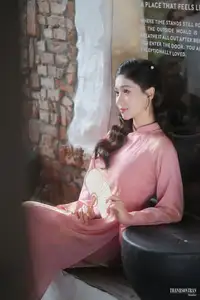 Serene Beauty of a Lady in Pink Traditional Dress with Spring Blossoms - image 1