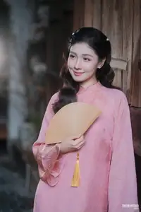 Serene Beauty of a Lady in Pink Traditional Dress with Spring Blossoms - image 4