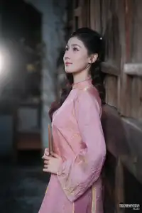 Serene Beauty of a Lady in Pink Traditional Dress with Spring Blossoms - image 2