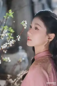 Serene Beauty of a Lady in Pink Traditional Dress with Spring Blossoms - image 8