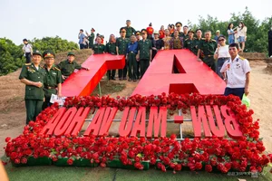Vibrant Red Flamboyant Flowers Bloom on the Historic A1 Hill in Dien Bien Phu - image 0