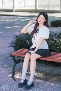Charming Schoolgirl in Elegant Uniform: A Glimpse of Youthful Beauty - image 1