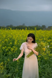 Ethereal Beauty: Xiao Yue Amidst Rapeseed Blooms in Art Language Vol.8948 - image 30