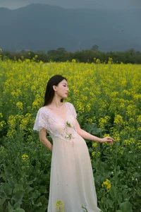 Ethereal Beauty: Xiao Yue Amidst Rapeseed Blooms in Art Language Vol.8948 - image 2