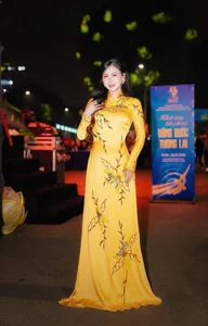 Radiant Beauty of the Yellow Ao Dai at Night - image 7