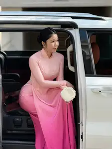 Elegant Pink Ao Dai Beauty: Gentle Charm of Vietnamese Women Captivates Every Gaze. - image 2