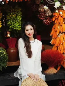Pure Elegance of White Ao Dai in Traditional Vietnamese Setting - image 12