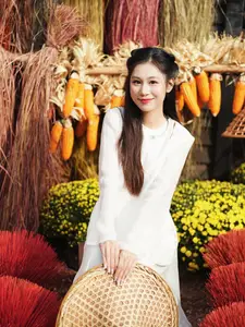 Pure Elegance of White Ao Dai in Traditional Vietnamese Setting - image 11