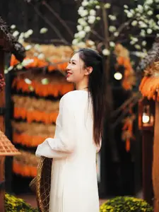 Pure Elegance of White Ao Dai in Traditional Vietnamese Setting - image 10