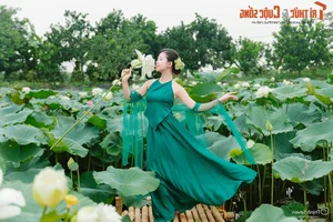 Graceful Beauty Queen in Traditional Yem Dress Amidst Early Season Lotus Blooms - image 7