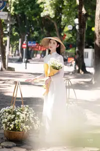 Vietnamese Ao Dai Beauty: Graceful girl with white daisies, an enchanting blend of tradition and charm. - image 8