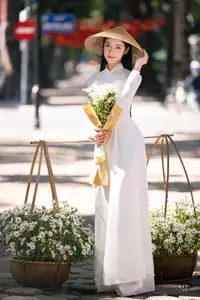Vietnamese Ao Dai Beauty: Graceful girl with white daisies, an enchanting blend of tradition and charm. - image 11