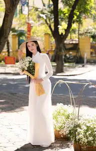Vietnamese Ao Dai Beauty: Graceful girl with white daisies, an enchanting blend of tradition and charm. - image 5