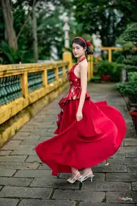 Elegant Asian Beauty in Red Dress Shines Gracefully Amidst a Traditional Garden 1000024509 - image 1