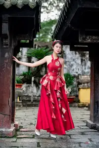 Elegant Asian Beauty in Red Dress Shines Gracefully Amidst a Traditional Garden 1000024509 - image 3