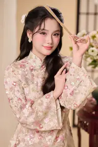 Graceful Vietnamese Woman Unveiled: Elegant Modern Ao Dai with Intricate Floral Patterns - image 6