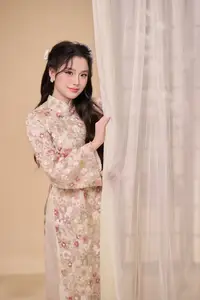 Graceful Vietnamese Woman Unveiled: Elegant Modern Ao Dai with Intricate Floral Patterns - image 9
