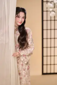 Graceful Vietnamese Woman Unveiled: Elegant Modern Ao Dai with Intricate Floral Patterns - image 2