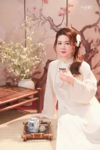 Graceful Asian Woman: Elegant Traditional Beauty in a Serene Tea Ceremony Moment. - image 0