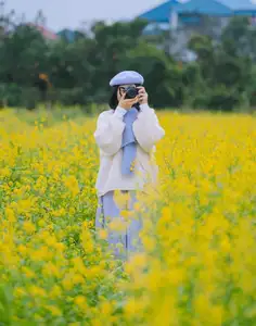 Immerse in Golden Rapeseed Fields: Girl's Artistic Photography Amidst Peaceful Charm, Attracting Year-End Visitors. - image 7