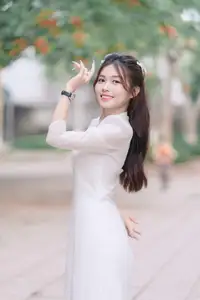Discover the Elegant Beauty of a Vietnamese Young Woman in White Áo Dài 1000026883 - image 0