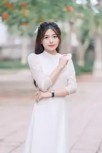 Discover the Elegant Beauty of a Vietnamese Young Woman in White Áo Dài 1000026883 - image 3