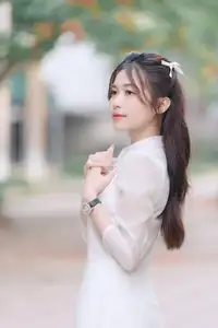 Discover the Elegant Beauty of a Vietnamese Young Woman in White Áo Dài 1000026883 - image 1