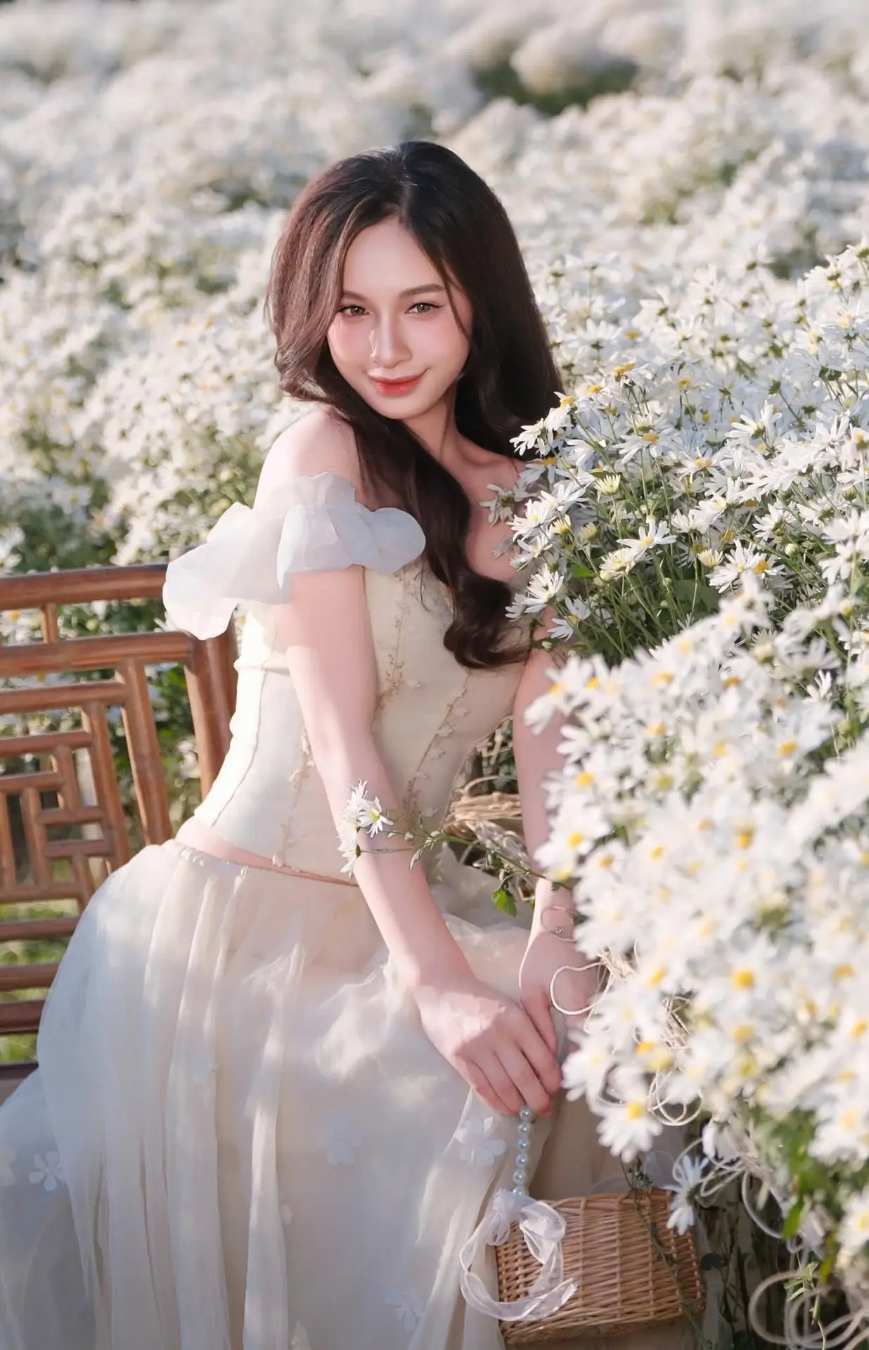 Enchanting Muse in White Chrysanthemum Field: A Portrait of Grace and Natural Beauty.