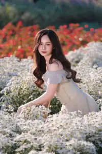 Enchanting Muse in White Chrysanthemum Field: A Portrait of Grace and Natural Beauty. - image 1
