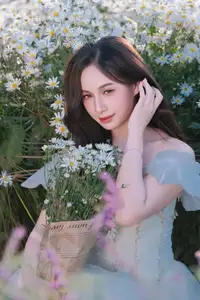 Enchanting Muse in White Chrysanthemum Field: A Portrait of Grace and Natural Beauty. - image 2