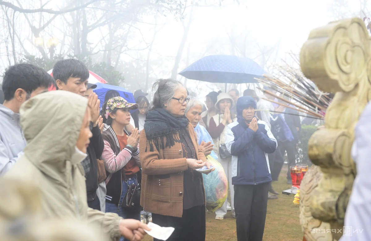 Spiritual Journey: Pilgrims Brave the Rain at Sacred Mountain Peaks to Collect Holy Water for Good Luck and Ancient Blessings