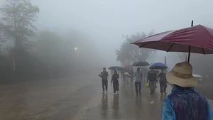 Spiritual Journey: Pilgrims Brave the Rain at Sacred Mountain Peaks to Collect Holy Water for Good Luck and Ancient Blessings - image 5