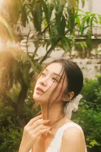 Dreamy Reflection: Girl in white dress finds gentle elegance in a garden mirror. - image 1