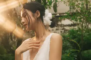 Dreamy Reflection: Girl in white dress finds gentle elegance in a garden mirror. - image 3