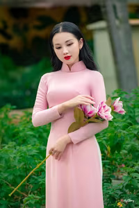 VGU No.158: Discover the Timeless Grace of Vietnamese Beauty in a Stunning Pink Ao Dai - image 0
