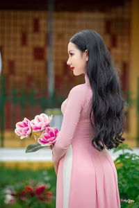 VGU No.158: Discover the Timeless Grace of Vietnamese Beauty in a Stunning Pink Ao Dai - image 7