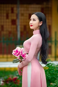 VGU No.158: Discover the Timeless Grace of Vietnamese Beauty in a Stunning Pink Ao Dai - image 4