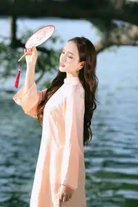 Elegant Vietnamese Beauty in Ao Dai by the Lake  A Glimpse of Hanoi's Serene Charm 1000025296 - image 1