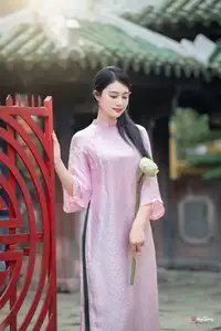 VGU No.163: The Graceful Beauty of a Vietnamese Girl in Traditional Pink Ao Dai Amidst Ancient Architecture - image 9
