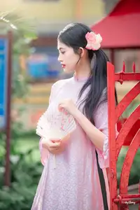 VGU No.163: The Graceful Beauty of a Vietnamese Girl in Traditional Pink Ao Dai Amidst Ancient Architecture - image 7
