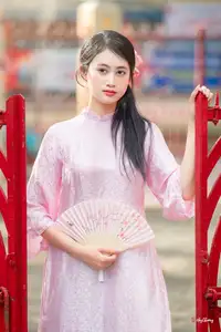 VGU No.163: The Graceful Beauty of a Vietnamese Girl in Traditional Pink Ao Dai Amidst Ancient Architecture - image 5