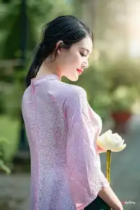 VGU No.163: The Graceful Beauty of a Vietnamese Girl in Traditional Pink Ao Dai Amidst Ancient Architecture - image 10