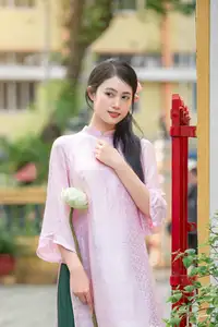 VGU No.163: The Graceful Beauty of a Vietnamese Girl in Traditional Pink Ao Dai Amidst Ancient Architecture - image 3