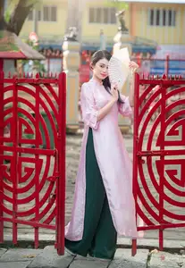VGU No.163: The Graceful Beauty of a Vietnamese Girl in Traditional Pink Ao Dai Amidst Ancient Architecture - image 11