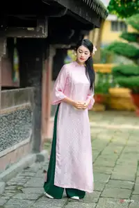 VGU No.163: The Graceful Beauty of a Vietnamese Girl in Traditional Pink Ao Dai Amidst Ancient Architecture - image 6