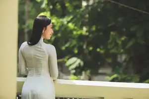 Elegant Vietnamese Woman in White Ao Dai: A Portrait of Traditional Grace and Conical Hat - image 5